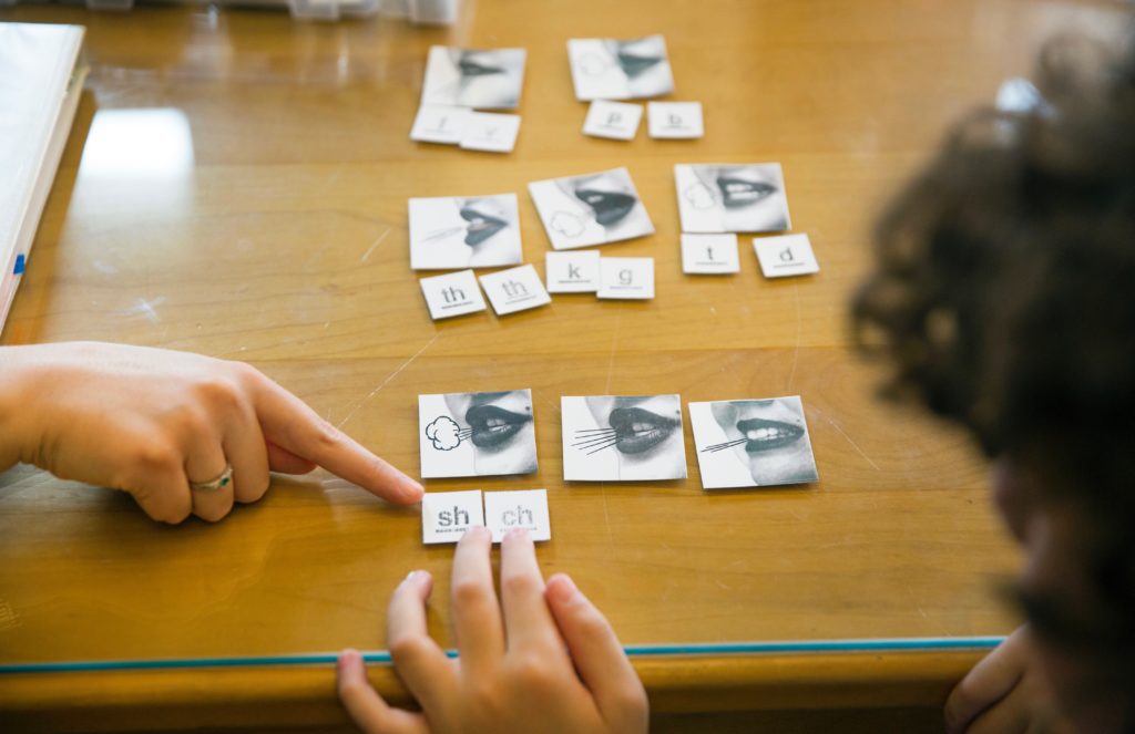 A student uses manipulatives to practice phonemes.