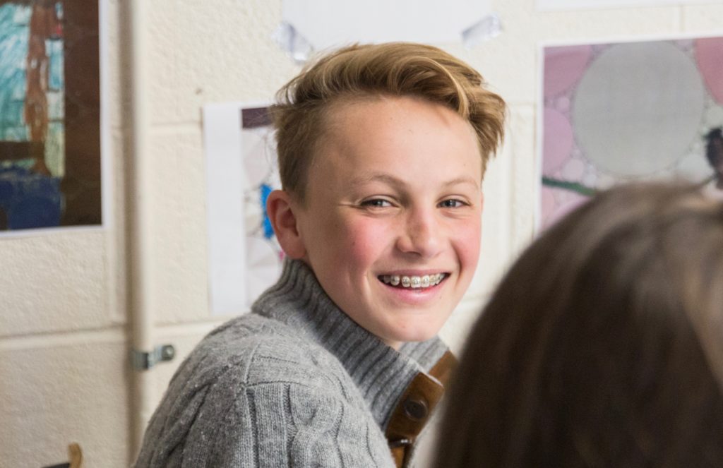 A smiling high school student.