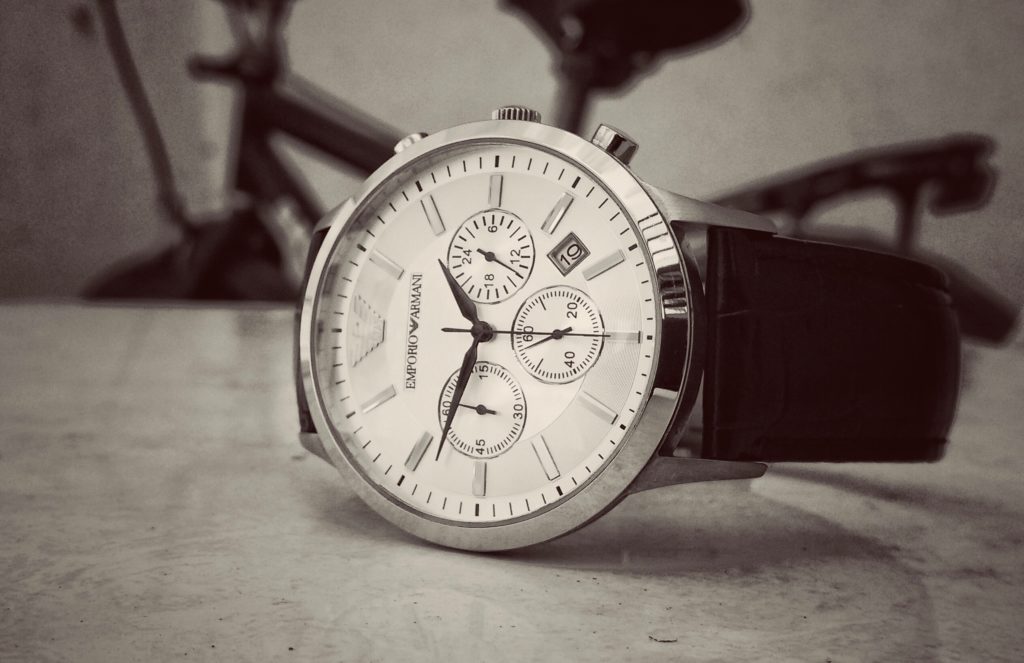 An analog watch on a table.