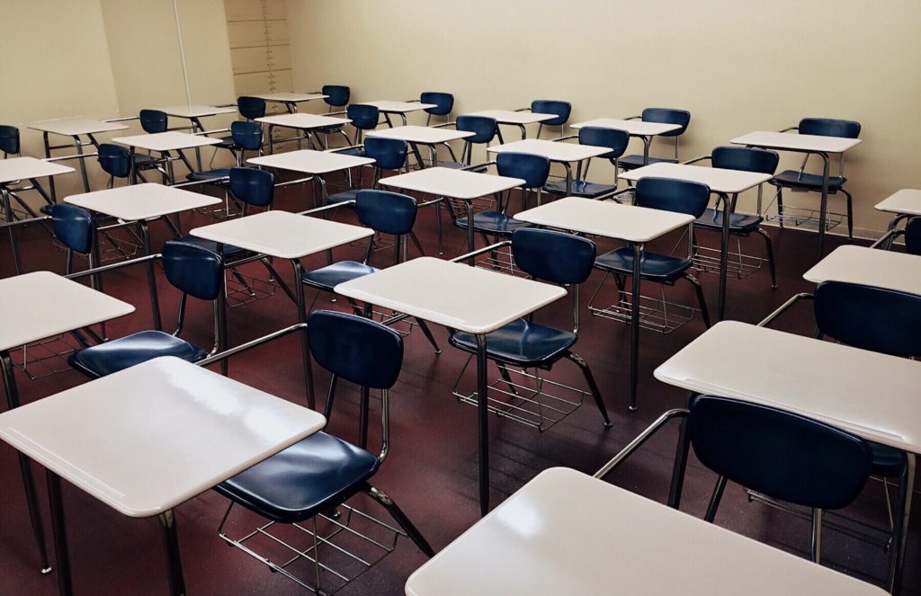 Rows of empty student desks.